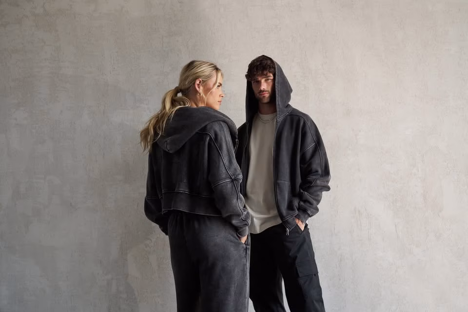 HERA models standing infront of a wall