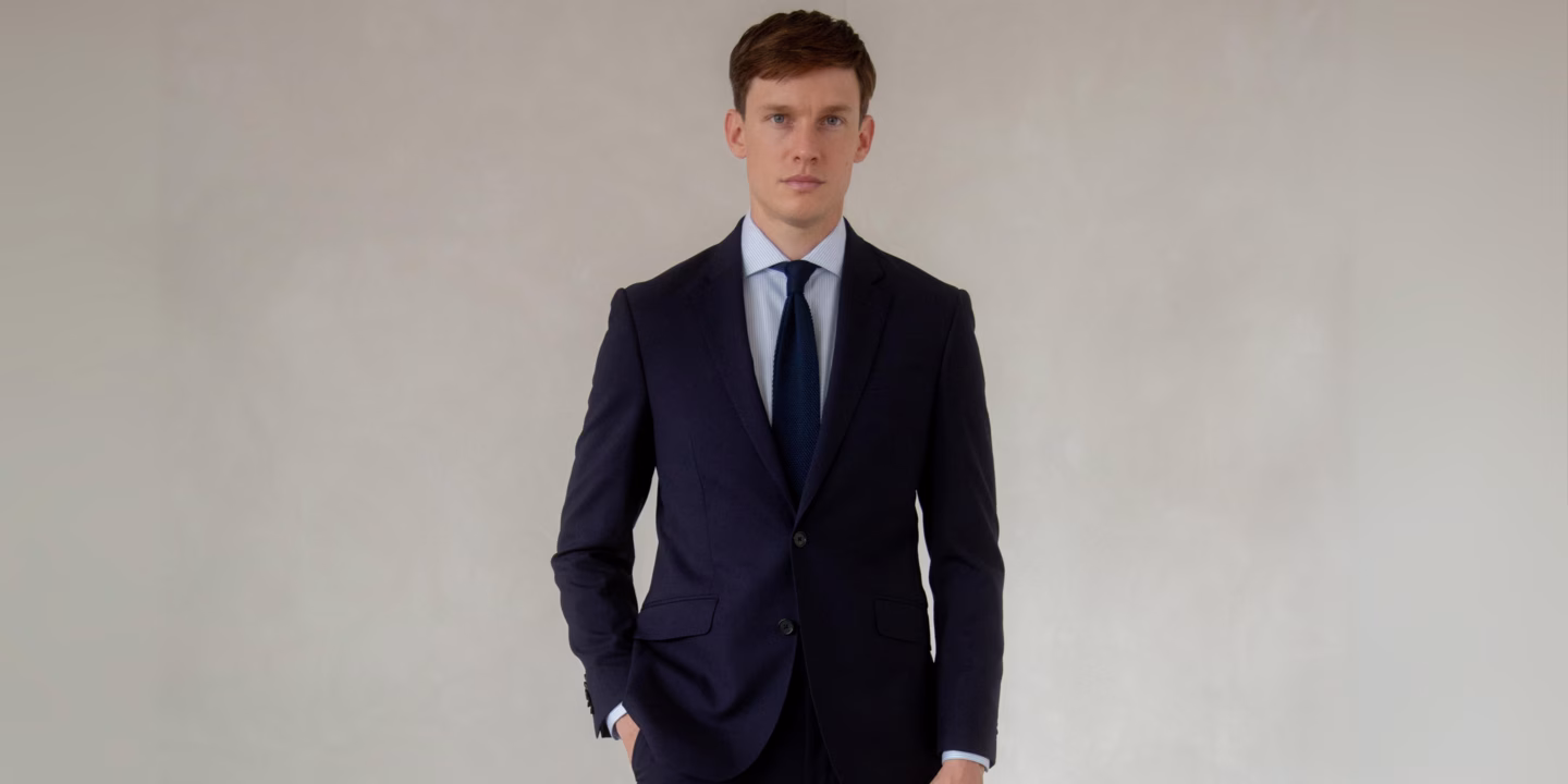 T.M.Lewin model wearing a suit and tie