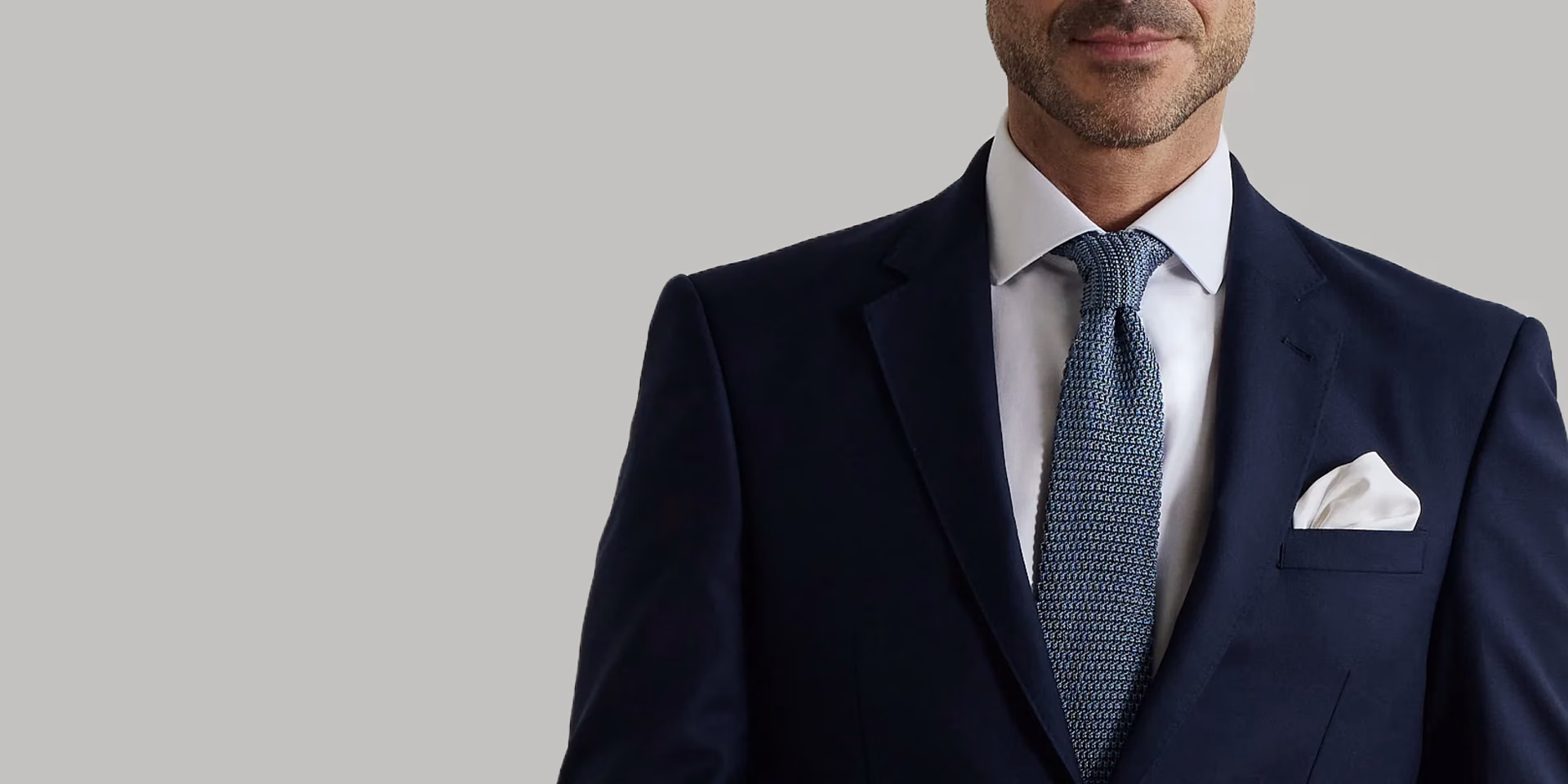 T.M.Lewin model wearing suit and tie